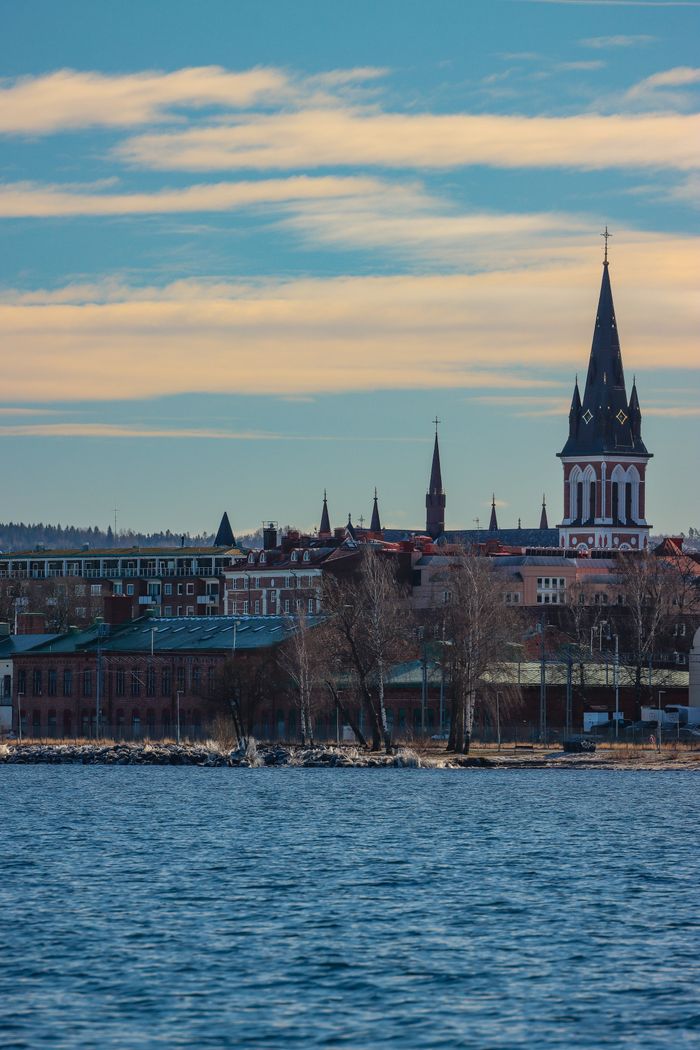 A picturesque view of Jönköping city with its iconic church tower and waterfront.